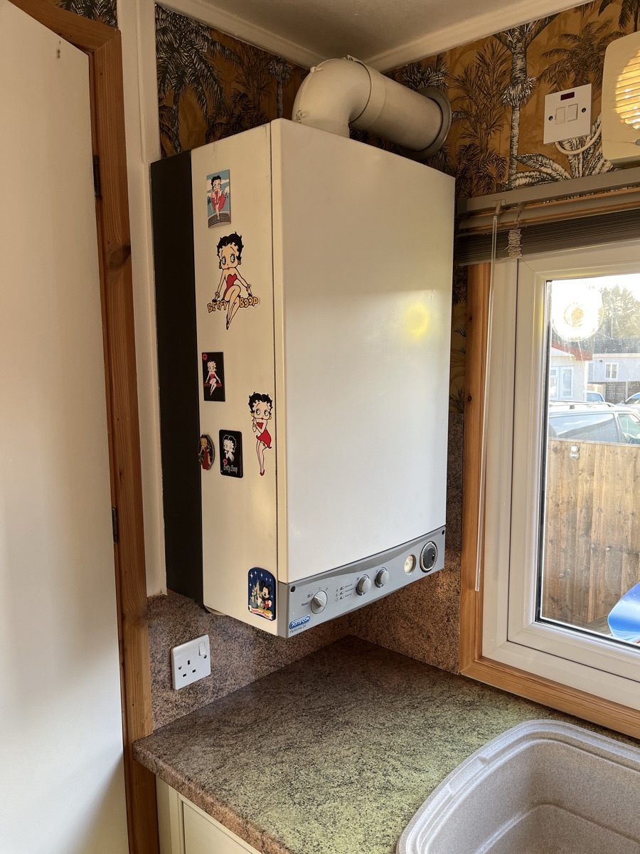 The original Potterton boiler in the corner of the kitchen before replacement