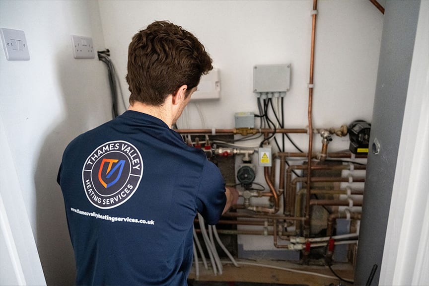 Heating engineer carrying out a boiler repair in Reading